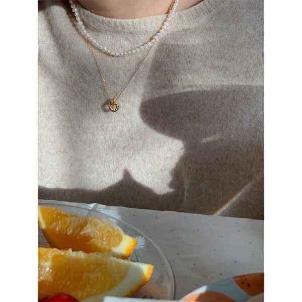 "Discover the intricate detail of our Gold Twisted Ring Pendant Necklace - Image 2