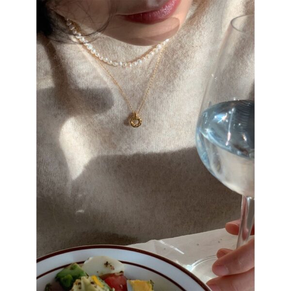 "Discover the intricate detail of our Gold Twisted Ring Pendant Necklace - Image 4